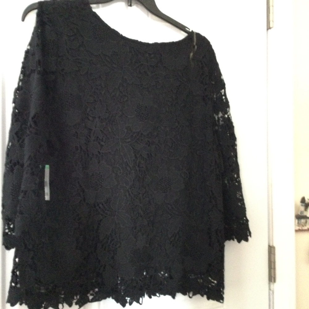 Excellent condition. Never worn. Black see through lace sleeve.Dressy top.